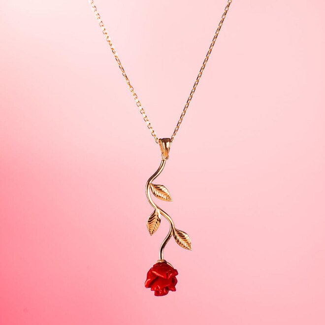 A silver necklace for women with a red rose design. - 4