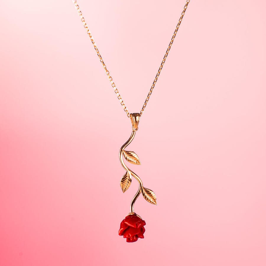 A silver necklace for women with a red rose design. - 4