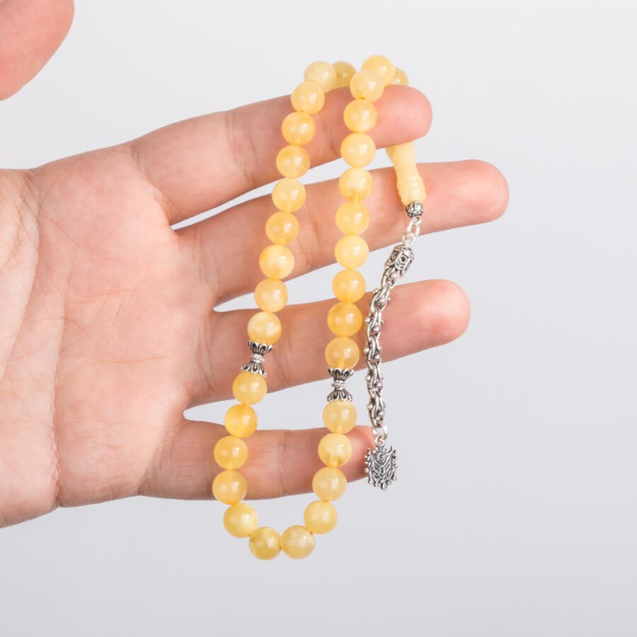 A wrist-sized amber rosary with a tassel having the Ottoman Coat - 2