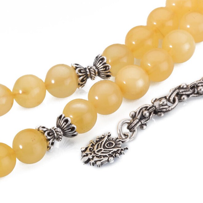 A wrist-sized amber rosary with a tassel having the Ottoman Coat - 3