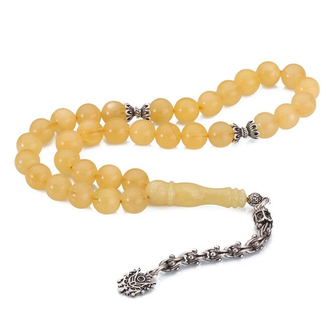 A wrist-sized amber rosary with a tassel having the Ottoman Coat - 1