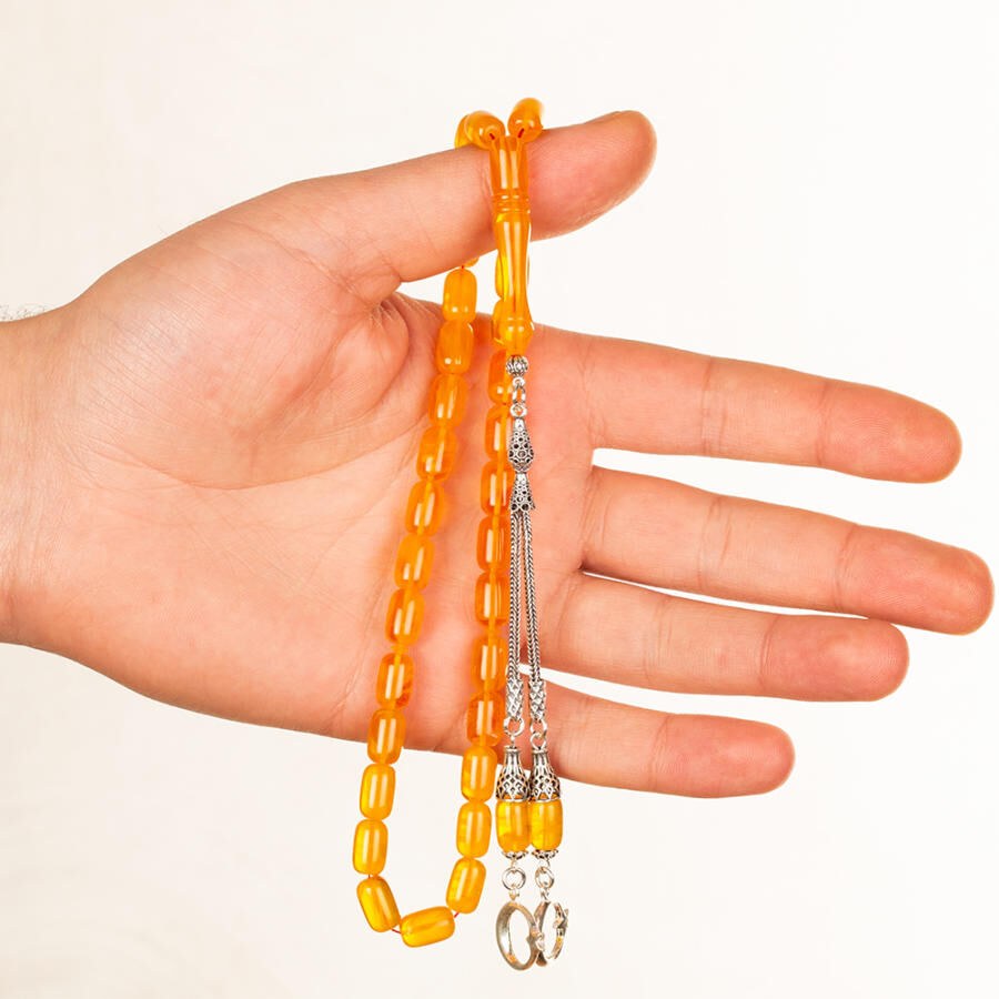 Rosary made of pressed amber with double tassel bearing a moon star symbol - 2